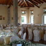 Set up of a wedding dinner in the ballroom